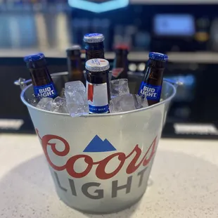 a bucket of beer bottles