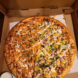 Half and half buffalo chicken ranch and Jamaican pizza