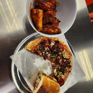 Wings, pizza, and brisket sandwiche.