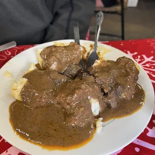 Biscuits and gravy.   It&apos;s a brown spicy gravy.