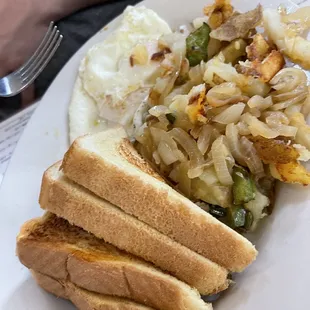 Hash browns with pepper and onions and eggs medium