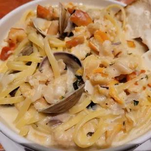 a bowl of seafood pasta