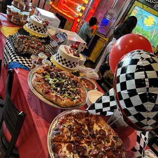 a table full of pizzas