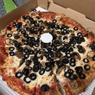 Thin crust mushroom and olive pizza.