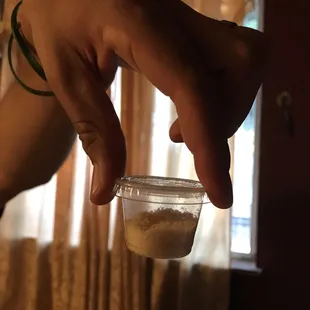 Tiny 1/2 full Parmesan container to go with the tiny pizza.