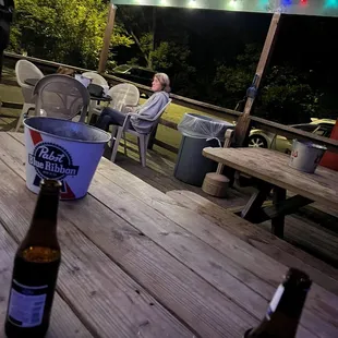 a beer on a picnic table