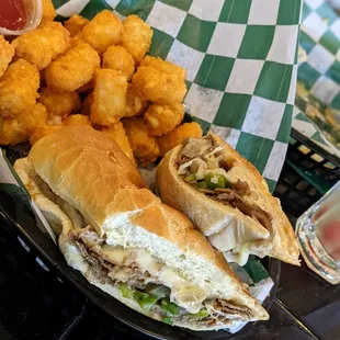 Philly steak sub with the best tater tots around