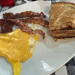 Hard egg with American cheese, bacon, and rye toast.