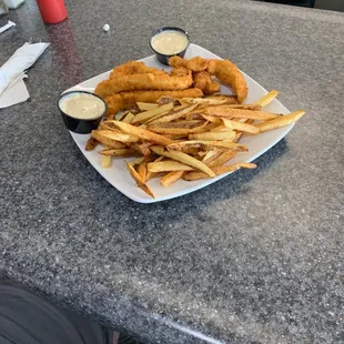 Hand breaded chicken fingers and fresh cut fries.