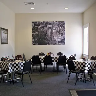 tables and chairs with checkered tablecloths