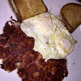 Big Apple Cafe house made corn beef hash with two eggs and two pieces of toast, good eatin&apos;!