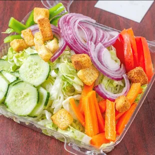 a salad in a plastic container