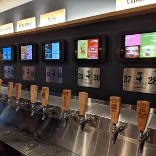 a man filling a beer from a tap