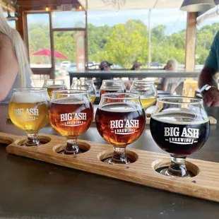 We have beer flight paddles now! Try everything on our 28 pour your own taps!