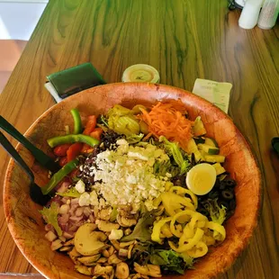 a wooden bowl of food