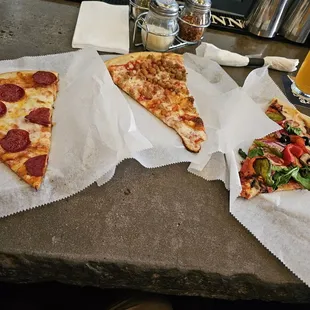&quot;Half ass&quot; slices of pepperoni,  sausage, and veggie pizza.