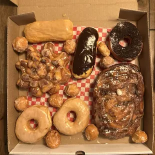 Cinnamon roll star, glaze, hot chocolate fritter, maple &amp; chocolate long Johns, Oreo crumb donut, and donut holes.