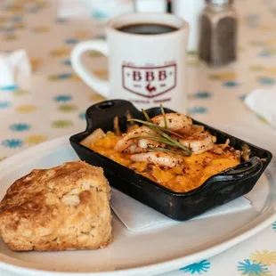 a plate of food and a cup of coffee