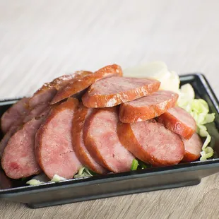 a plate of sliced meat