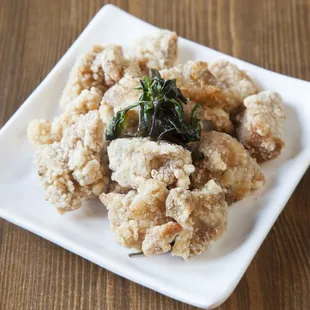 a plate of food on a wooden table