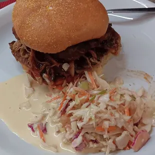 The Big Bad Wolf sandwich is brisket, barbeque, and bacon. Tasty coleslaw!