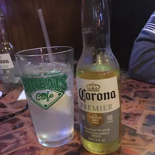 a bottle of corona beer and a glass of water