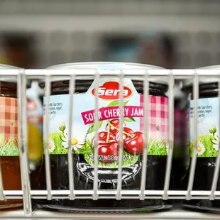 a row of jars of fruit jam