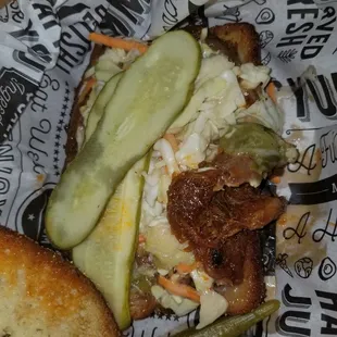 a sandwich with pickles and bread