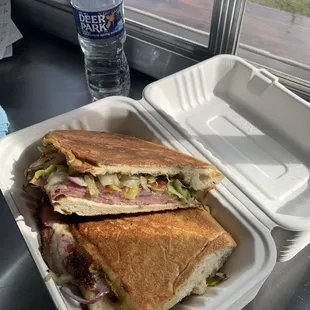 a sandwich in a styrofoam container
