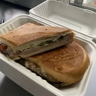 a sandwich in a styrofoam container