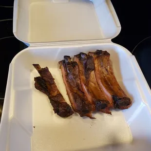 bacon in a styrofoam container
