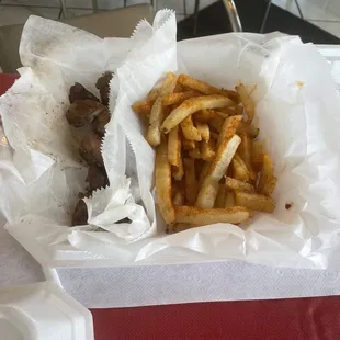 Beef tips and fries lunch portion.