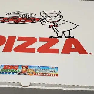 a pizza box with a man holding a pizza