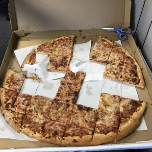 My co workers jumped in so quick I didn't get a shot of the pizza before many a slice was eaten! Scissors are to show scale!!
