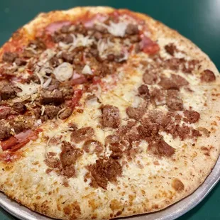 Meat pie with onions and garlic on one side and white pie with sausage on the other