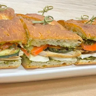 a plate of sandwiches on a table