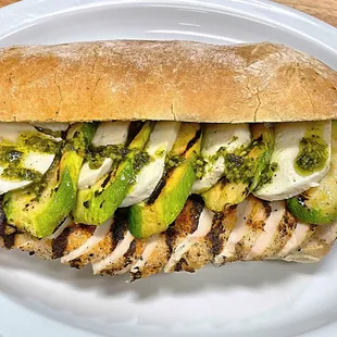 a grilled chicken sandwich with avocado