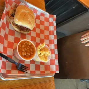 pulled pork sandwich with bake beans and mac n cheese