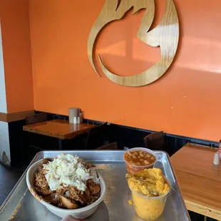 Pulled chicken bowl with dirty rice and apple coleslaw. Sides are sweet potato casserole and baked beans.