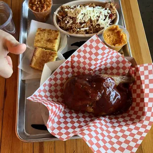 Half chicken, cornbread, sweet potato casserole and pulled chicken over rice.