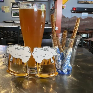 a beer and pretzels