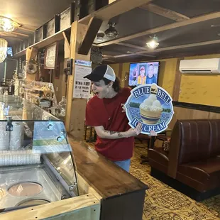 a man serving a cupcake