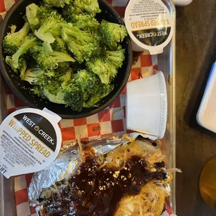 Baked potato with pulled pork and side of broccoli