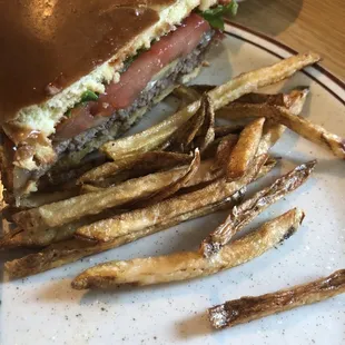 Cheese burger and fresh cute fries.