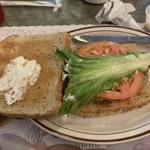 Chicken sandwich on rye bread. Comes with whatever condiments you want.