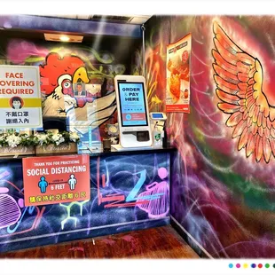 Inside. Order/Pickup Area. Social Distancing.etc. I like The Funky Colorful Graffiti ! ...Cool!