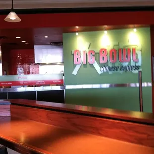 a long wooden table with chairs