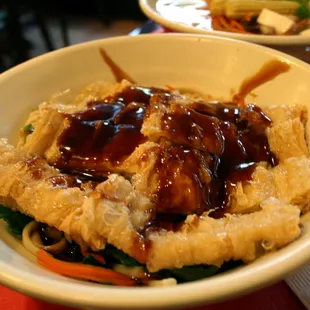 Crispy Tofu with noodles and brown sauce.