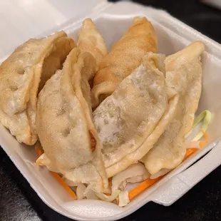 dumplings in a styrofoam container