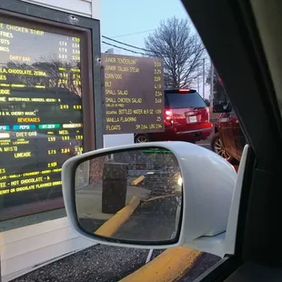 a menu in a rear view mirror